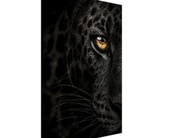 May include: A rectangular canvas print featuring a close-up, side-profile view of a black panther's face. The animal has dark fur with subtle rosette patterns and a single, piercing amber-colored eye that stands out against the black background.