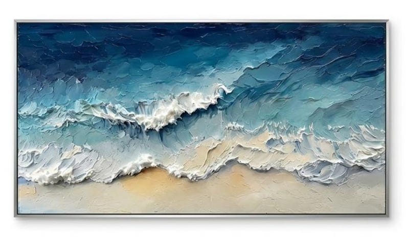 May include: Abstract ocean waves painting in shades of blue, white, and beige. The textured artwork depicts a seascape with foamy waves crashing onto a sandy beach. The painting is framed in a silver rectangular frame.