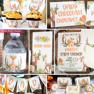 May include: A woodland themed baby shower party with decorations featuring deer, foxes, and squirrels. The decorations include cupcake wrappers, water bottle labels, favor bags, and a banner that says "Baby".