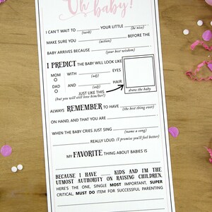 May include: A printable baby shower game card with pink and black text. The card has instructions for guests to write a note for the mom-to-be before the baby arrives. The card includes prompts like "I can't wait to...", "Make sure you...", "Baby arrives because...", "I predict the baby will look like...", "Always remember to have...", "When the baby cries just sing...", "My favorite thing about babies is...", "I wish you...", and "XOXO".
