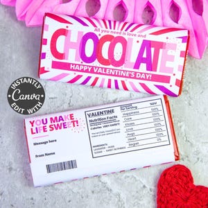 May include: Two chocolate bar wrappers with Valentine's Day themes. One wrapper says "CHOCOLATE" in pink and red, with "Happy Valentine's Day!" below. The other says "You Make Life Sweet!" with space for a message and name.