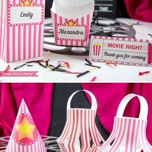 May include: Pink and white striped party favor bags with a movie night theme. The bags are decorated with stars and have a space for a name. The bags are perfect for holding small treats or gifts.