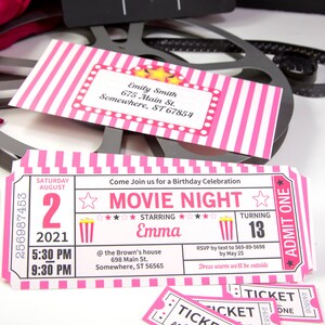 May include: Pink and white striped movie ticket invitation for a birthday party. The invitation says "Movie Night" and features a popcorn bucket, stars, and the name "Emma". The date is August 2, 2021, and the time is 5:30 PM to 9:30 PM. The address is 698 Main St., Somewhere, ST 56565. The RSVP information is to text 569-89-5698 by May 25. The invitation also says "Dress warm we'll be outside".