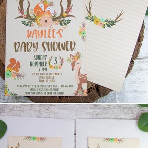 May include: A baby shower invitation with a woodland theme. The invitation features a deer with a floral crown, a squirrel, and a fox. The text on the invitation reads "Please join us for Kaylee's Baby Shower, Sunday, November 3, 2-4pm, at the home of her parents, 25465 Main St, Town, ST 91355. Please RSVP by text to Chris by Oct 31st - 912-555-8208. Kaylee is registered at Target. Bring some diapers to enter the raffle!"