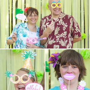 May include: A photo booth set with props for a luau party. The props include a pineapple hat, pineapple glasses, a ukulele, a speech bubble that says "Party like a pineapple", a speech bubble that says "Aloha!" and a pink mouth.
