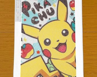 May include: A diamond painting kit featuring a yellow Pikachu character on a white canvas with a color legend, the text PIKACHU, and a 20x30 cm size label. The design includes red cheeks, black-tipped ears, and small star accents in a grid pattern.
