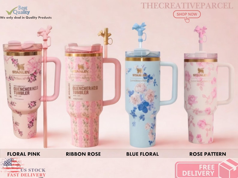 May include: Four Stanley Quencher H2.0 tumblers with handles and straws. The first is pink with floral patterns, the second is pink with ribbon rose designs, the third is light blue with floral prints, and the fourth is white with rose patterns.