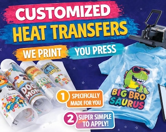 May include: Customized heat transfers with the text WE PRINT YOU PRESS, 1 SPECIFICALLY MADE FOR YOU, and 2 SUPER SIMPLE TO APPLY. The image shows rolled transfer sheets with colorful cartoon graphics and a light blue t-shirt with a dinosaur print.