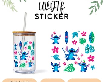 May include: A clear glass tumbler with a bamboo lid and straw, decorated with blue cartoon character graphics, pink flowers, and green leaves. The words "UV DTF STICKER" are at the top. Additional stickers are displayed to the right.