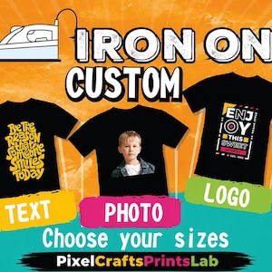 May include: Three black t-shirts displayed on an orange background. The left shirt features yellow text reading Be The Reason That Someone Smiles Today. The centre shirt displays a child's photo. The right shirt shows text reading ENJOY THIS SWEET MOMENT. Text labels include TEXT, PHOTO, LOGO, and PixelCraftsPrintsLab.