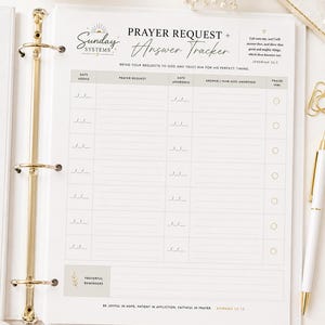 May include: A white paper prayer request and answer tracker insert for a binder. The page features columns for date added, prayer request, date answered, answer, and praise. It includes the text Sunday Systems, Prayer Request + Answer Tracker.