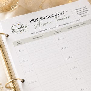 May include: A white paper prayer request and answer tracker sheet with black text and gold accents. The header reads Sunday Systems Prayer Request + Answer Tracker. It includes columns for date added, prayer request, date answered, and answer.