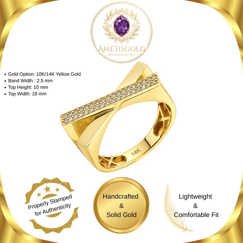 May include: A gold ring with a unique, geometric design. The ring features a band width of 2.5 mm, a top height of 10 mm, and a top width of 18 mm. The ring is adorned with small, sparkling stones. The text "14K" is visible on the ring.