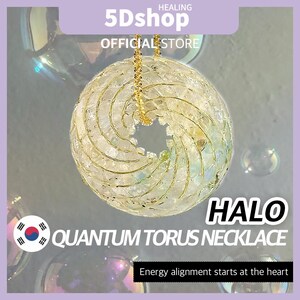 May include: A clear, spherical Quantum Torus necklace with a gold chain. The pendant has a halo design and is made of iridescent material. The text "HALO QUANTUM TORUS NECKLACE" is displayed on the image, along with the phrase "Energy alignment starts at the heart."