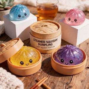 May include: A collection of colorful, squishy dumpling toys in a bamboo steamer. The dumplings are blue, pink, yellow, and purple, each with a smiling face. The steamer has the text "Steamed Squishy Dumpling" and "Soft Squishy Toys 3+".
