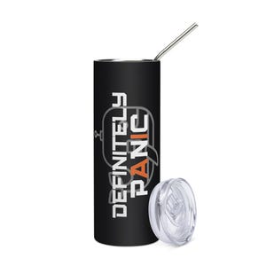 May include: A black cylindrical tumbler with a metal straw and a clear plastic lid. The tumbler features the white text "DEFINITELY" stacked above the orange text "PANIC" with a faint gray outline of a robot head behind the lettering.
