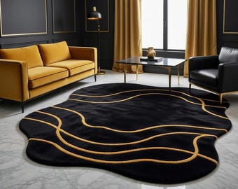 Alfombra Abstract Puddle: Alfombra de lana negra tejida a mano con ondas doradas – Decoración contemporánea