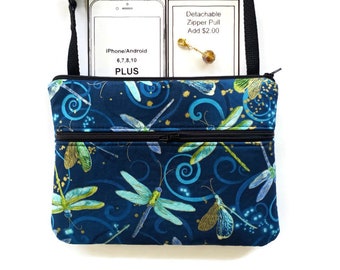 May include: A navy blue crossbody bag with a dragonfly pattern. The bag has a black strap and two zippered compartments. The text on the card says "iPhone/Android 6,7,8,10 PLUS". A detachable zipper pull is also shown.