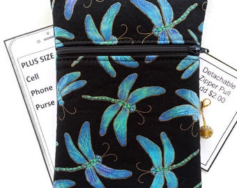 May include: Black crossbody purse with a dragonfly print. The purse has two zippered compartments and a detachable zipper pull.  "Plus Size"  "Cell Phone Purse" is written on a white card behind the purse.  "Detachable Zipper Pull add $2.00" is written on a white card to the right of the purse.
