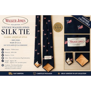 May include: A navy blue silk tie featuring a repeating pattern of small American flag embroidery. The tie includes a white label on the back that reads Walker Jones Houston. The tie measures approximately 58 inches long and 3.75 inches wide.