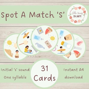 Pode incluir: Conjunto de cartões educativos com o texto "Spot A Match 's'". Os cartões apresentam ilustrações de objetos que começam com a letra 's', como um sol, um cofre e um veleiro. O conjunto inclui 31 cartões e é projetado para o reconhecimento do som inicial 's'.