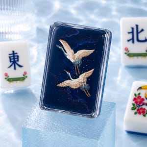 May include: A rectangular mahjong tile featuring a deep navy blue surface with a detailed illustration of two white cranes in flight. The cranes have red accents on their heads and blue feathers on their wings, set against a dark starry sky background.