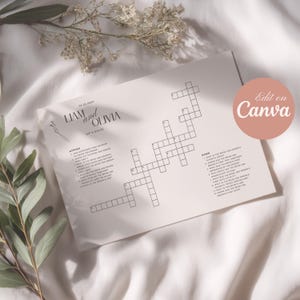 Puede incluir: Un crucigrama blanco con los nombres "Liam y Olivia" y la fecha "05.05.2023" impresos. El rompecabezas incluye pistas en "Across" y "Down". Un círculo rosa con "Edit on Canva" es visible.