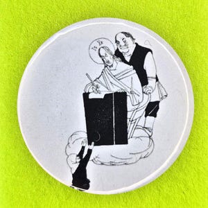 May include: A circular pin-back button featuring a black and white illustration of a figure writing at a desk with another figure standing behind, on a bright lime green backing card with the text HAQ JOB and Niche gifts for radical human beings.