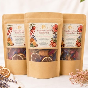 May include: Three stand-up kraft paper pouches containing Strawberry Moon Simmer Pot aromatic botanical blend. Each label features illustrations of strawberries, orange slices, and flowers, with text detailing ingredients and directions.