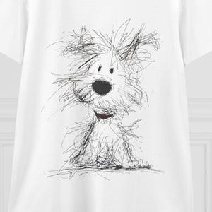 以下が含まれることがあります： 前面に黒いインクで描かれた毛むくじゃらの犬のスケッチがプリントされた、白い半袖Tシャツ。このグラフィックは、緩い走り書きのような線で構成されており、暗い鼻を持つ小さくふわふわした犬の形を表現しています。