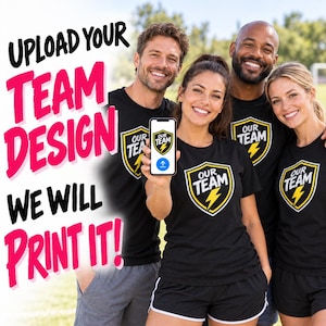 May include: Four individuals wearing black t-shirts with a yellow and black shield logo featuring a lightning bolt and the text OUR TEAM. One person holds a smartphone displaying the same logo and an upload icon. Text reads UPLOAD YOUR TEAM DESIGN WE WILL PRINT IT!
