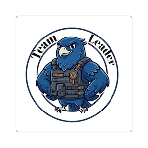 May include: A square sticker with a blue cartoon falcon wearing a tactical vest. The falcon is within a circular border with the words "Team Leader" around it. The vest has the word "Falcon" on it.