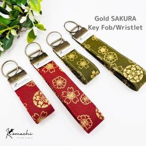 Gouden Sakura sleutelhangertje voor om de pols - Traditionele Japanse stof / Sleutelhangertje / iPhone-polsbandje / Cadeau