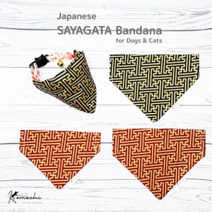 May include: Japanese Sayagata bandanas for dogs and cats. The bandanas feature a black and gold geometric pattern, and a red and gold geometric pattern. One bandana is attached to a collar with a bell.