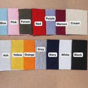 May include: A color palette of fabric swatches in various shades, including blue, pink, forest green, red, purple, maroon, cream, ash, yellow, orange, grey, navy, white, and black. Each swatch is labeled with its corresponding color name.