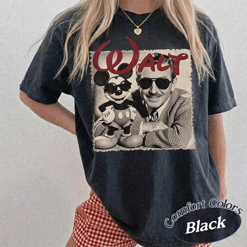 May include: Black t-shirt featuring a vintage-style graphic of Mickey Mouse and Walt Disney wearing sunglasses. The word "Walt" is above the image in red. The shirt has a distressed look and the words "Comfort Colors Black" are printed on the bottom right.
