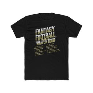 May include: A black short-sleeve t-shirt featuring the white and gold text FANTASY FOOTBALL WAIVER TOUR. Below the title, a list of fourteen numbered items includes phrases like HIGH HOPES, TRADE WAR, BYE WEEK, INJURY REPORT, and GLORY OR SHAME.