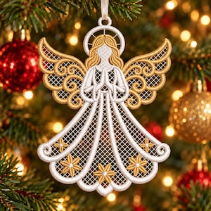 May include: A white and gold embroidered angel ornament featuring a halo, wings with intricate scrollwork, and a long gown decorated with small star-shaped accents. The figure has hands pressed together in a prayer position and a ribbon loop.