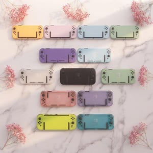 May include: A collection of twelve handheld gaming console cases arranged in a grid. The cases feature various solid and translucent pastel colors including yellow, pink, blue, green, purple, white, black, and lime green, each with button layouts.