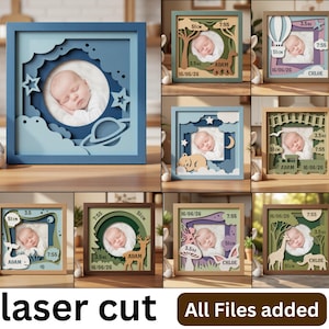 May include: A collection of square, multi-layered laser-cut wooden shadow box frames featuring circular centre cutouts for baby photos. Each frame displays unique themes like space, animals, and nature, with engraved text including names, dates, and measurements.