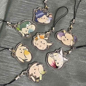 May include: Seven clear acrylic charms featuring illustrated, round, fluffy creatures with various accessories, including hats, flowers, and food items. Each charm is attached to a black cord with a silver-toned metal lobster clasp and jump ring.