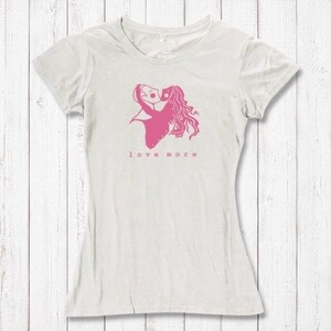 Ivory white Love More T-Shirt for women with pink heart graphic, crafted from bamboo & organic cotton. Romantic and sustainable gift idea.