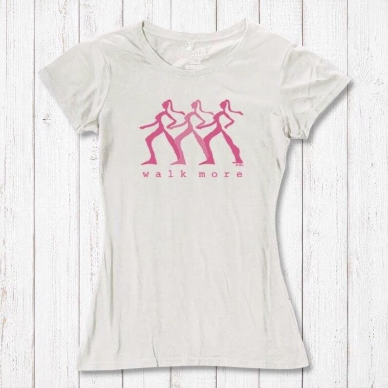 Women's Walking T-Shirt in Bamboo & Organic Cotton in off-white with pink 'Walk More' graphic. Sustainable fitness tee for hikers and walkers.