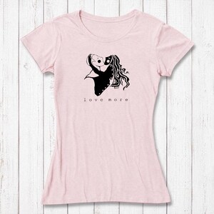 Light pink Women's Love More T-Shirt in bamboo & organic cotton with white heart graphic. Perfect romantic eco-gift for girlfriend or wife.