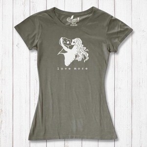 Olive green Women's Love More T-Shirt in bamboo & organic cotton with white heart graphic. Eco-conscious romantic apparel gift.