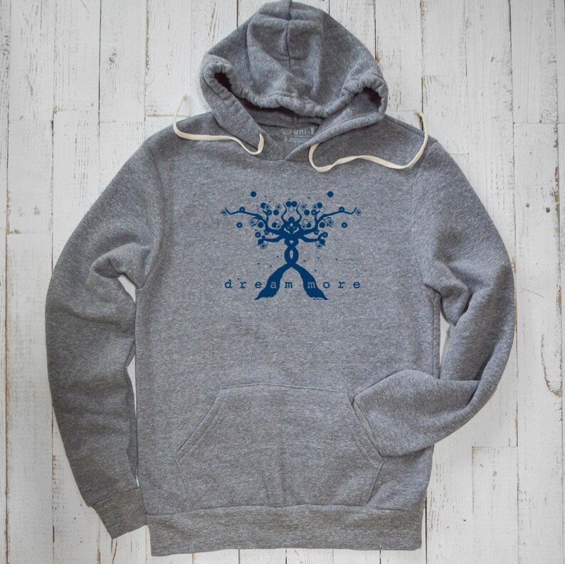 May include: A gray hooded sweatshirt with a blue graphic of a tree with the text "dream more" underneath.