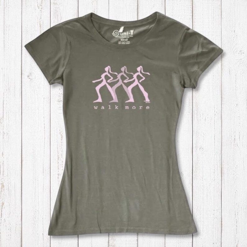 Olive green Women's Walking T-Shirt in Bamboo & Organic Cotton with pink 'Walk More' design. Eco-conscious activewear for outdoor lovers.