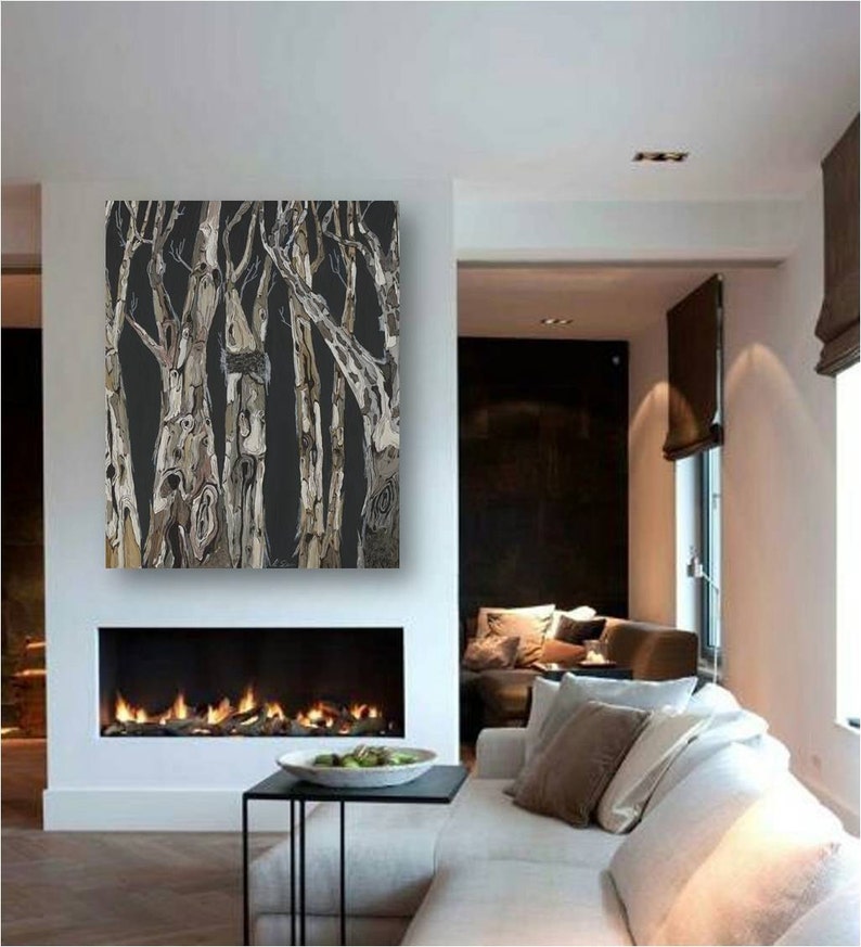 May include: A black and white abstract painting of trees with a textured, brushstroke effect. The painting is hanging above a fireplace in a modern living room.