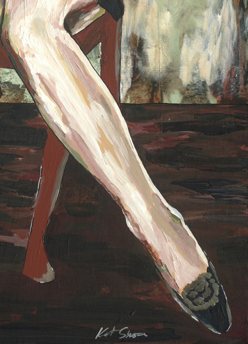 May include: A close-up of a woman's leg wearing a black and white patterned stocking. The leg is bent at the knee and the foot is pointing towards the bottom of the image. The background is a dark brown color.