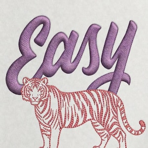 May include: White t-shirt with an embroidered design. The design features the word "EASY" in purple script above a red and white tiger. The tiger is standing with its head facing forward.